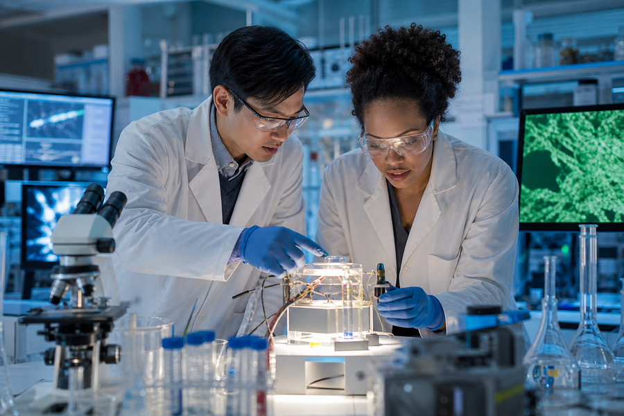 Asian Man and Black Woman in Research Lab with Equipment and Computer-1